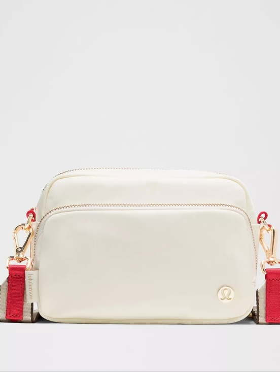 lululemon athletica Handbags - Lululemon Everywhere Crossbody Bag Ivory Red Gold Hardware Striped Wordmark